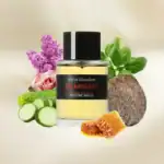 Olivia Giacobetti En Passant fragrance bottle with natural ingredients background.