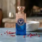 Electimuss fragrance bottle with a blue and rose gold design.