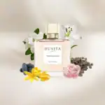 Dusita Fleur de Lalita perfume bottle with floral and spice accents, elegantly displayed with flower.