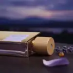 Fuin luxury perfume bottle with wooden cap, lavender sprigs, and amber gemstone.