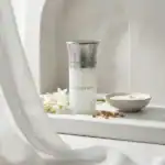 Blanche Bete skincare product in elegant silver and white bottle.