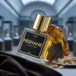 Nishane Ani perfume bottle with gold cap and black label.