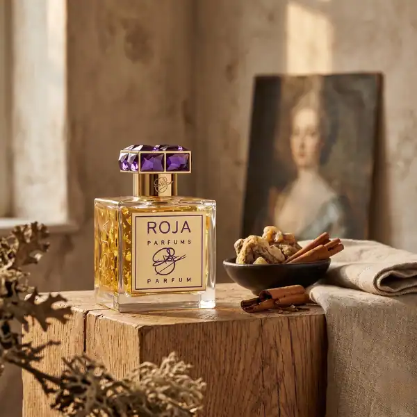 Roja Parfums Haute Luxe fragrance bottle with purple cap on a wooden surface.