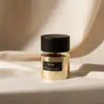 Kirké fragrance by Milzana Terenzi, elegant gold bottle with black cap, perfect for niche perfume en.
