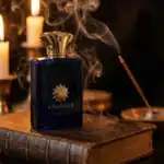Amouage Interlude fragrance bottle with smoke and candles in the background.