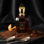 Xerjoff Golden Oud fragrance bottle with rich amber color and gold accents.