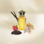 Luxury perfume bottle with crown detail, surrounded by berries, spices, and natural elements at Beau.