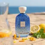 Atelier Riviera Sunrise by Des Ors - A luxurious fragrance bottle showcased outdoors.