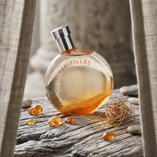 Hermes Eau des Merveilles fragrance bottle, 100ml, with a sleek design and silver cap.