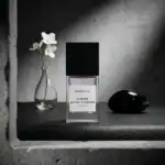 BohoBoco Coffee White Flowers fragrance bottle on a textured surface with a minimalist background.