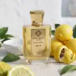 Unique Luxury Izmir perfume bottle with fresh lemon and citrus accents, perfect for a luxurious scen.