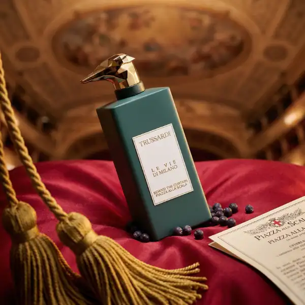 Trussardi Le Vie Di Milano fragrance bottle with a bird-shaped cap, elegant design.