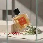 Guerlain Heritage Eau de Toilette fragrance bottle with red label and black cap.