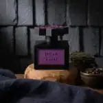 Jihan by Kajal fragrance bottle with purple label.