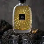 Atelier Lune Féline fragrance bottle with gold accents, luxurious and elegant.