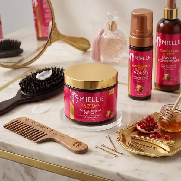 Mielle Organics Pomegranate & Honey Moisturizing Shampoo - A luxurious hair care product available a.