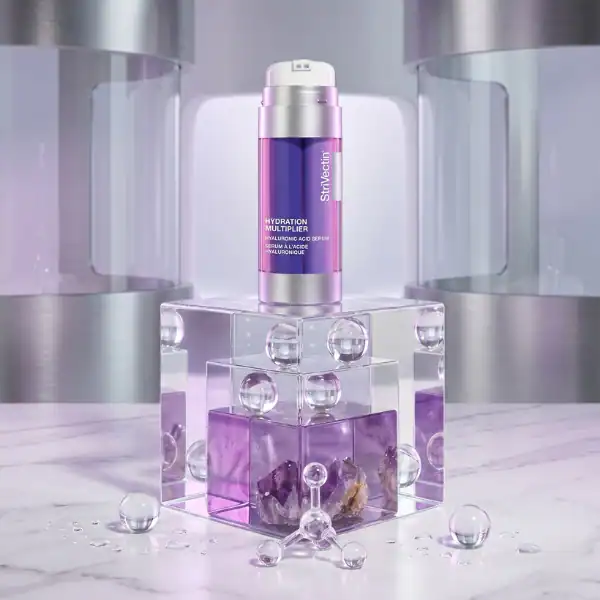 Hydration Multiplier Serum by StyleVita in a sleek purple bottle on a modern display.
