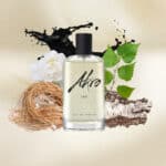 Ato Ink fragrance bottle with natural elements and black ink splash, highlighting luxury and eleganc.