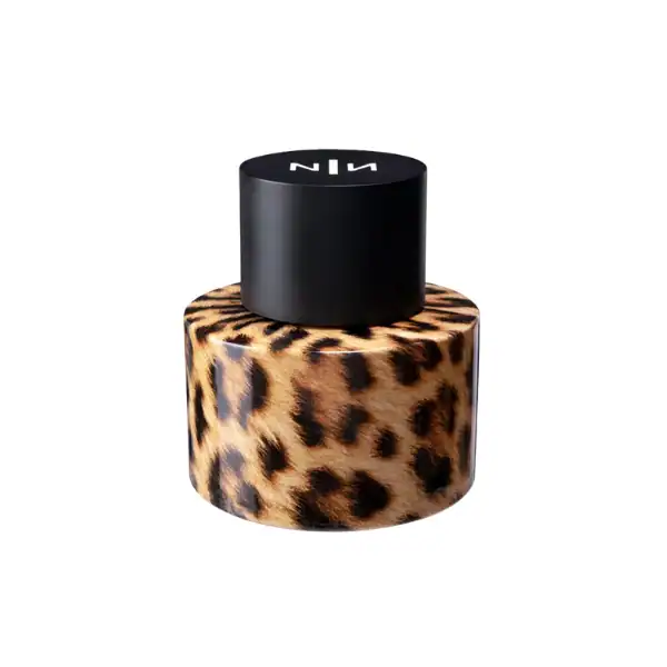 smoky-makeup Exotic leopard print high-end perfume container with sleek black cap.
