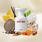 Bold musky perfume bottle surrounded by pineapple, vanilla, honeycomb, musk, and natural botanical elements.