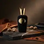 Cospiro Opera fragrance bottle with gold cap and black body, elegant and luxurious.