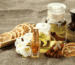 Alwa luxury perfume collection with dried citrus slices, cinnamon sticks, and essential oils.