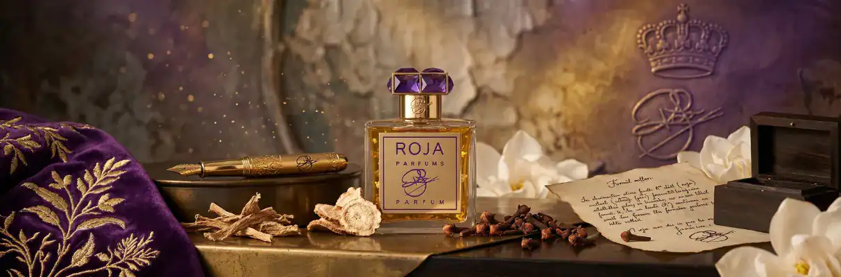 Elegant perfume bottle with purple accents, surrounded by luxurious accessories and handwritten note.