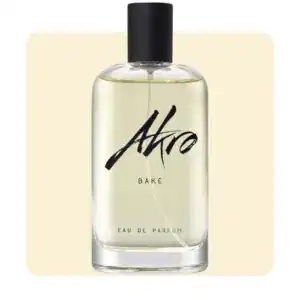 A sleek, minimalist perfume bottle with black cap and clear liquid inside.