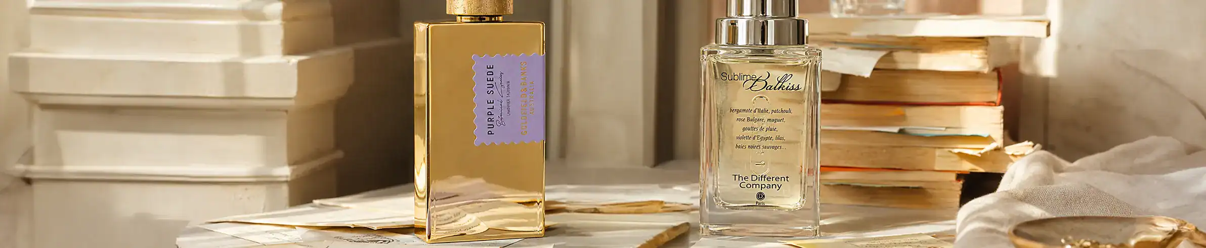 Elegant perfume bottle with gold accents and purple label, placed on a marble surface.