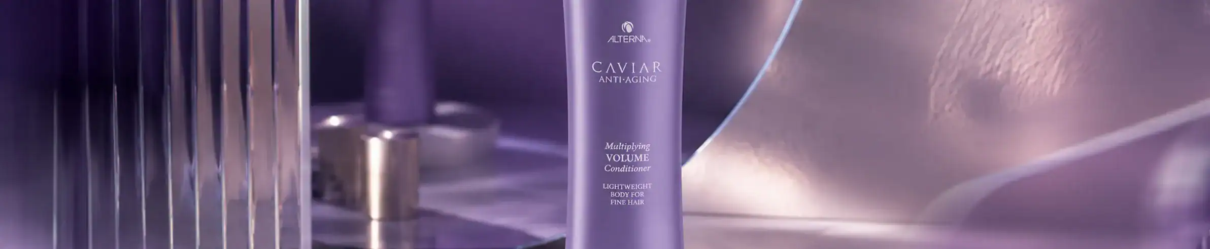 Luxurious purple hair care bottle with silver accents, ideal for high-end professional hair treatmen.