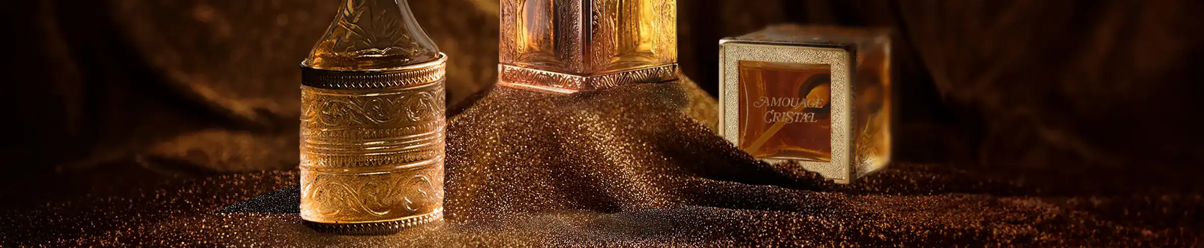 Elegant perfume bottles with gold accents and sophisticated design.
