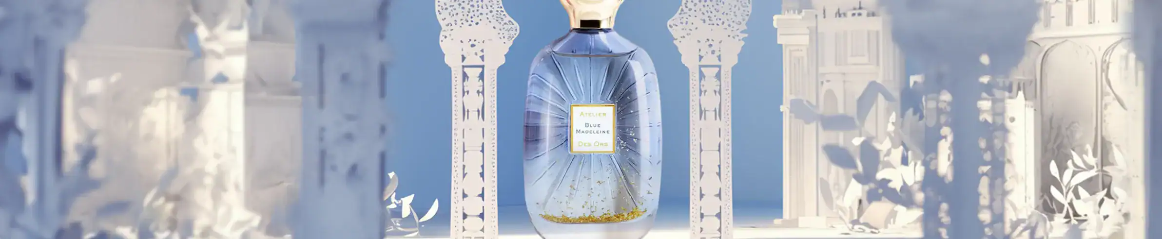 Elegant blue perfume bottle with gold details, perfect for luxury fragrance collection.