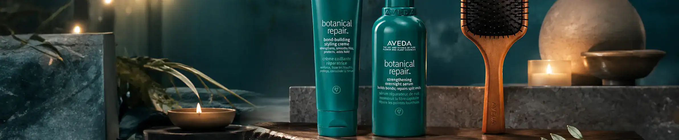 Botanical skincare products with a wooden brush and candles for a luxurious spa experience.
