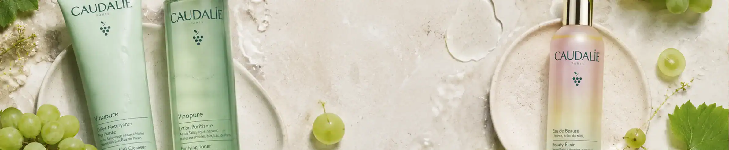 Caudalie skincare collection featuring green grape extracts and elegant packaging.