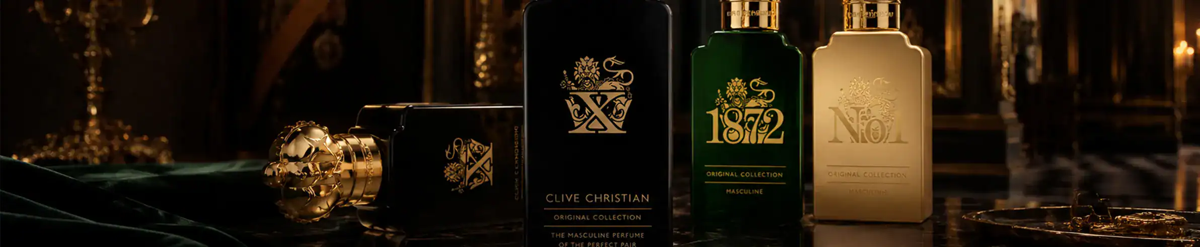 Elegant perfume bottles with gold details and sophisticated packaging.