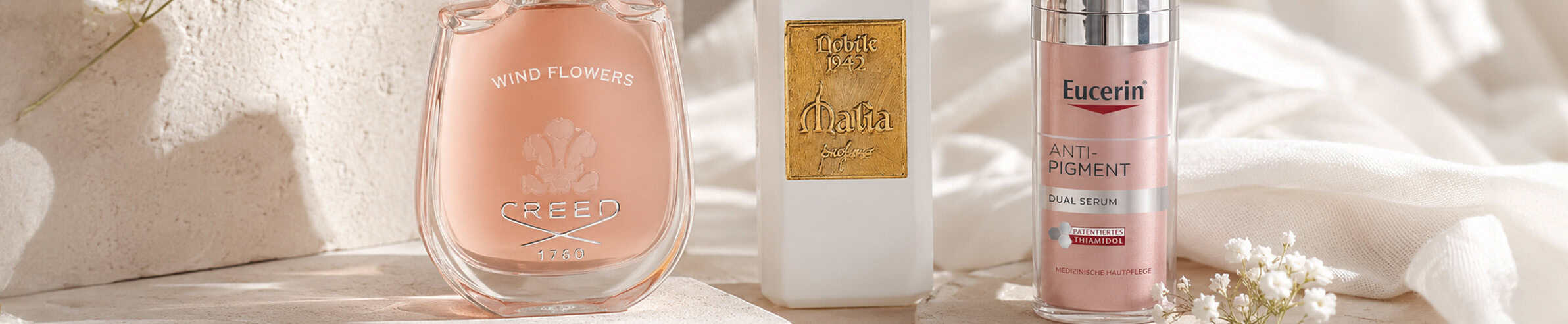 Creed Wind Flowers perfume - Elegant fragrance in a pink glass bottle.