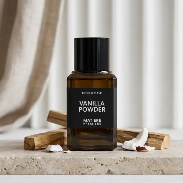 Amber glass bottle of Vanilla Powder perfume extract with black label and cap.