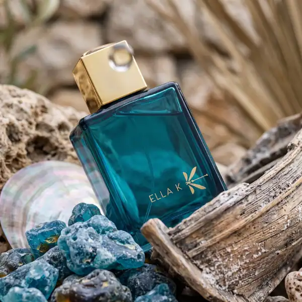 Ella K Orchid K Eau de Parfum - A luxurious fragrance in a teal glass bottle with gold accents.
