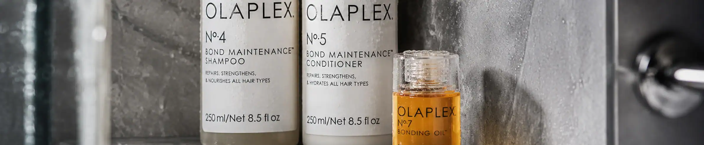 Olaplex No.4 Bond Maintenance Shampoo and No.5 Conditioner, 250ml bottles, professional hair care.