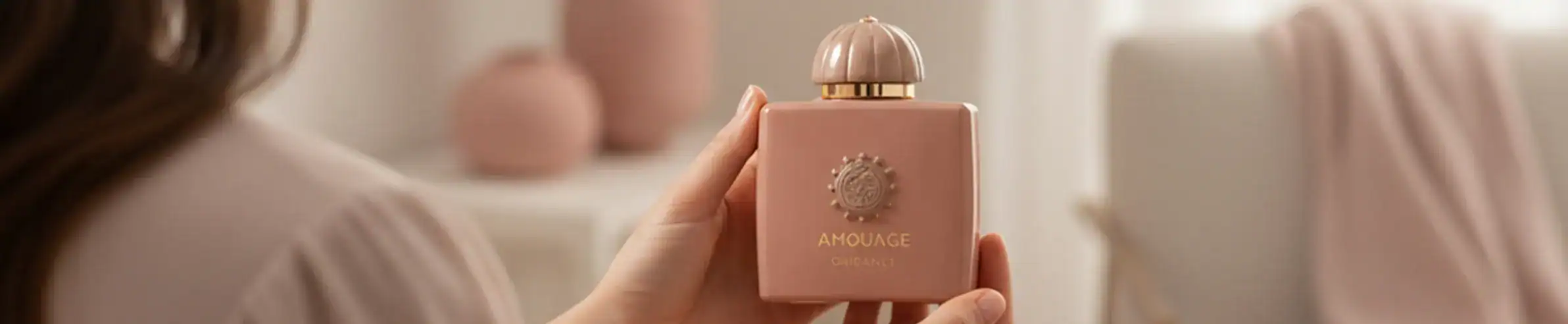 Anouge perfume bottle - Elegant pink fragrance bottle with gold cap.