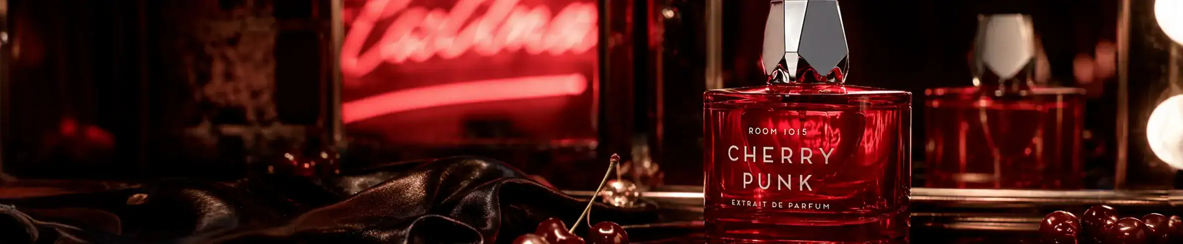 Cherry Punk fragrance - a luxurious perfume in a red glass bottle with a silver cap.