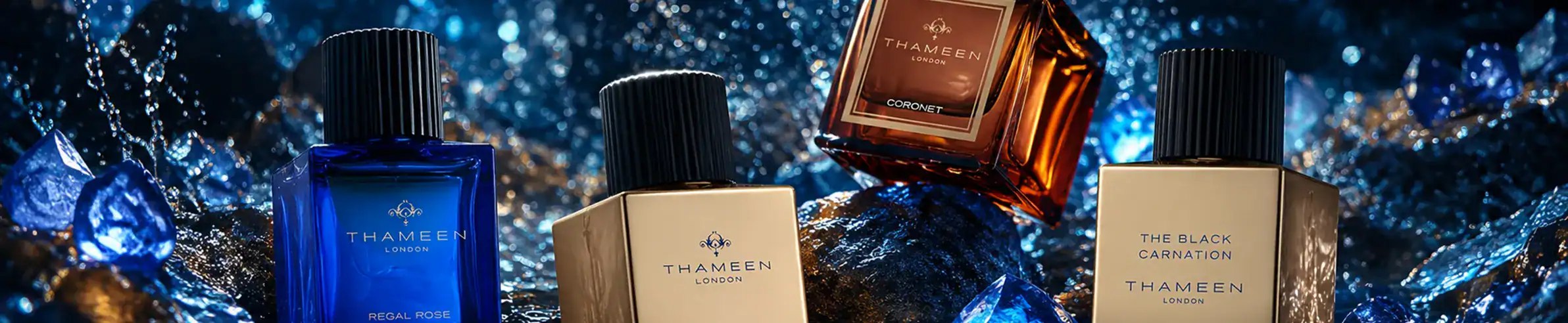 Thameen luxury perfume bottles collection with blue, beige, and amber glass, elegant design, visible.
