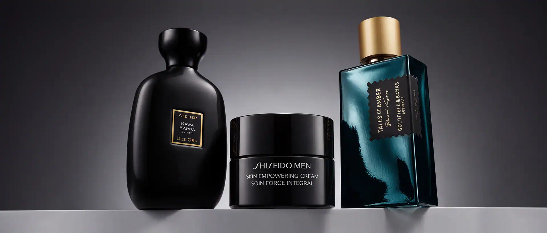 Shiseido Men Skin Empowering Cream and Atelier Cologne perfume bottles.
