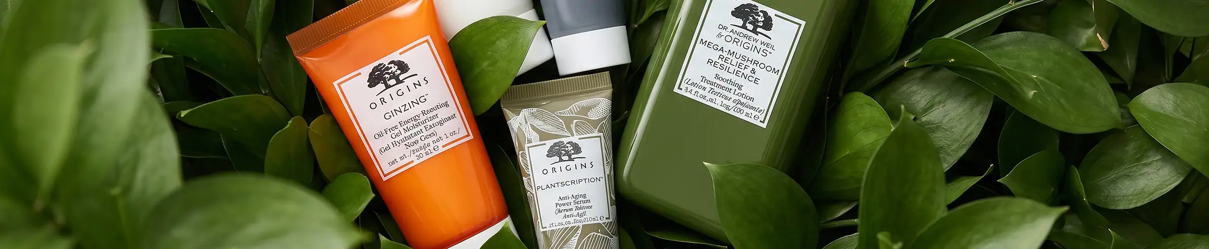 A collection of luxury skincare products from Aesop, including cleansers and moisturizers.